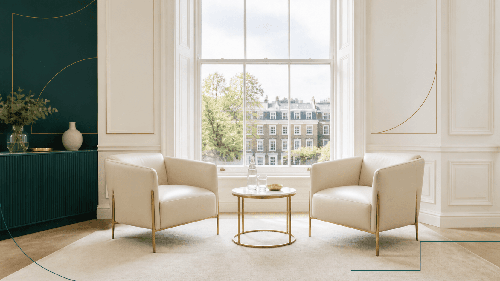 Two cream armchairs prepared for a fireside conversation in a bright London room